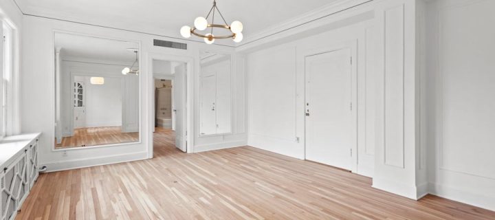 bare room with white ceiling, walls, and wood flooring